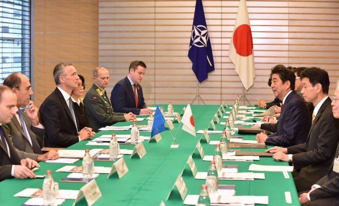Japanese Prime Minister Shinzo Abe (3rd R) meets with NATO chief Jens Stoltenberg (3rd L).