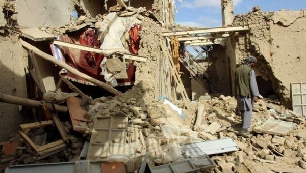 An Afghan man inspects a house destroyed during an air strike called in to protect Afghan and U.S. forces during a raid on suspected Taliban militants, in Kunduz, Afghanistan November 4, 2016.