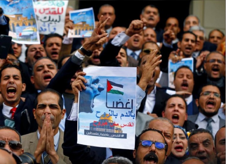 In Cairo, Egyptians demonstrate, carrying posters reading “be furious, Jerusalem will not be lost” while participating in an anti-Israel, anti-Trump rally at the Lawyers Syndicate.