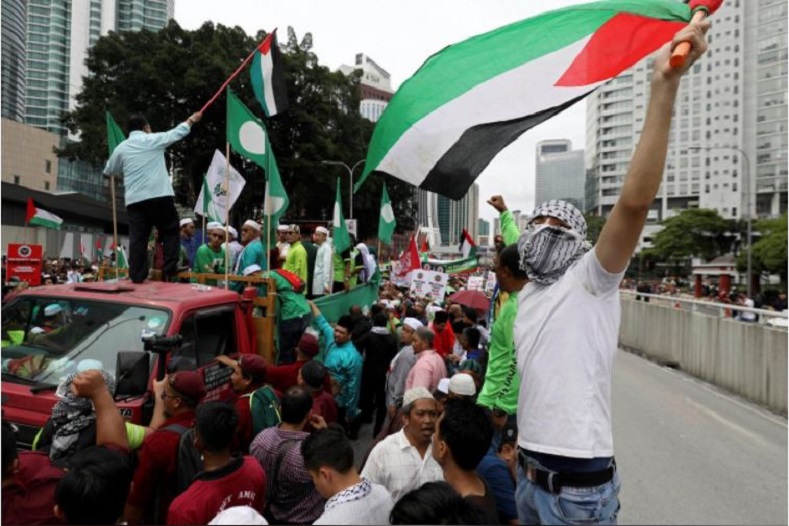 Protesters clashed with police forces Friday following a march to the U.S. embassy in Kuala Lumpur, Malaysia.