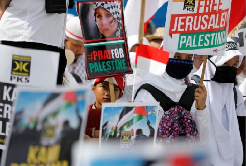 Muslim supporters shout slogans during a protest outside the U.S. embassy.