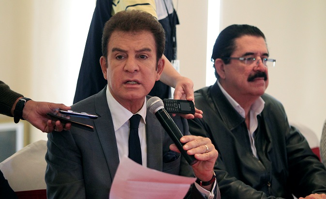 Salvador Nasralla, presidential candidate for the Opposition Alliance, speaks during a news conference with former Honduran president Manuel Zelaya.