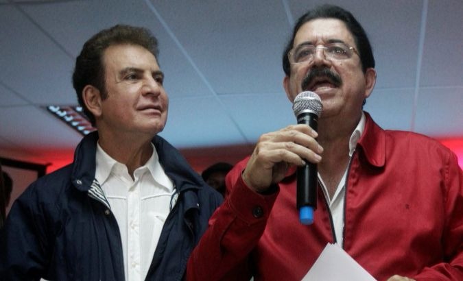 Opposition leader Salvador Nasralla (L) with backer and former President Manuel Zelaya.