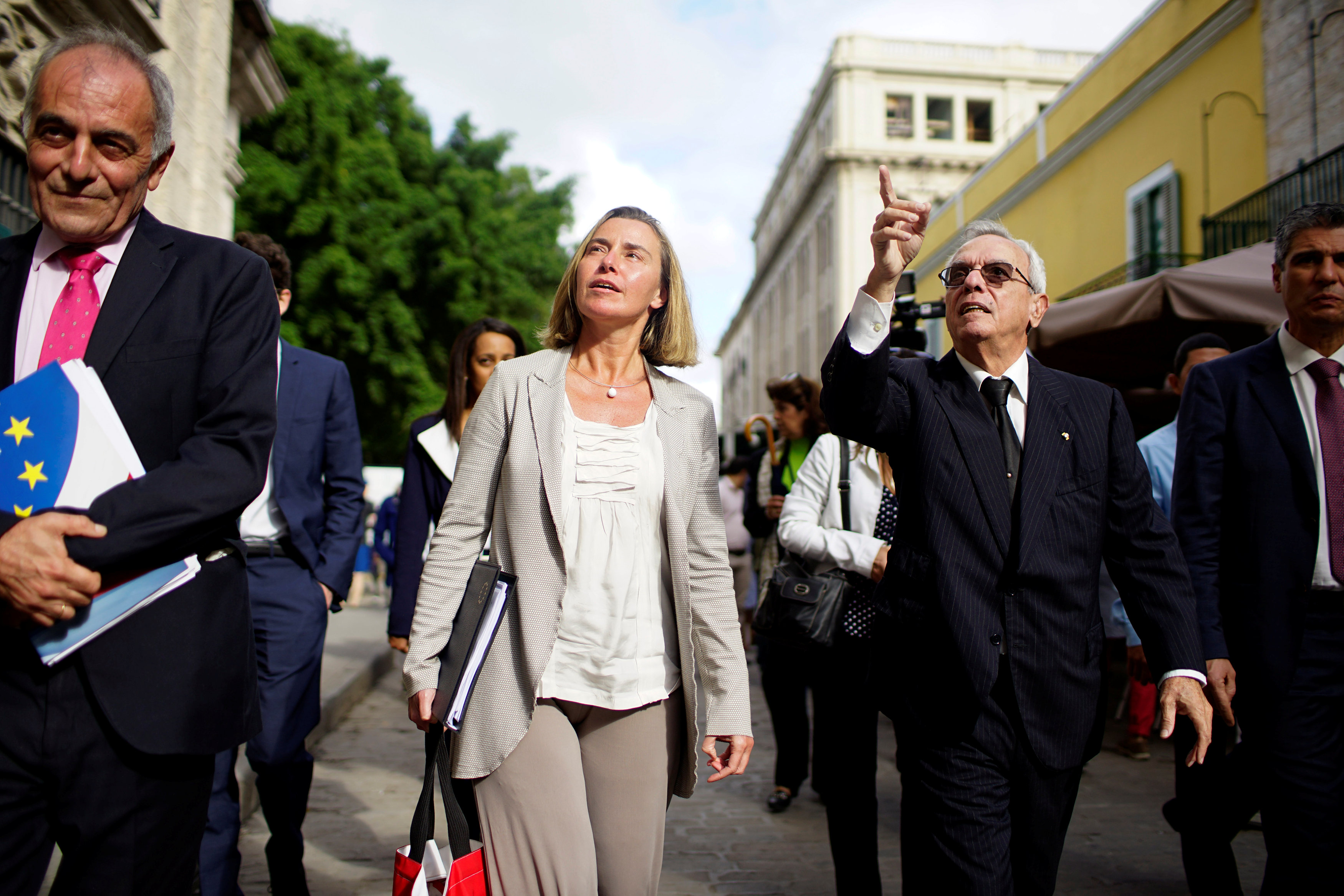 European Union’s diplomat Federica Mogherini (2nd L) speaks to Eusebio Leal (2nd R), a leading intellectual and the official historian of the city of Havana as they walk through Old Havana, Cuba, January 3, 2018.