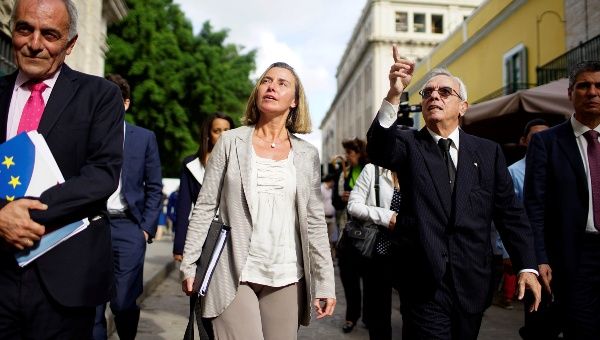 European Union’s diplomat Federica Mogherini (2nd L) speaks to Eusebio Leal (2nd R), a leading intellectual and the official historian of the city of Havana as they walk through Old Havana, Cuba, January 3, 2018. 