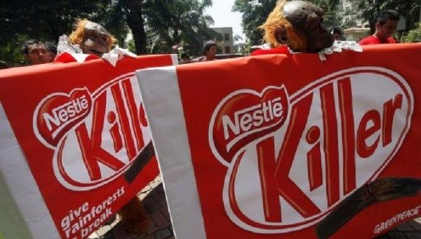 Greenpeace activists protest to demand Nestle drops Indonesian palm oil producer Sinar Mas Group.