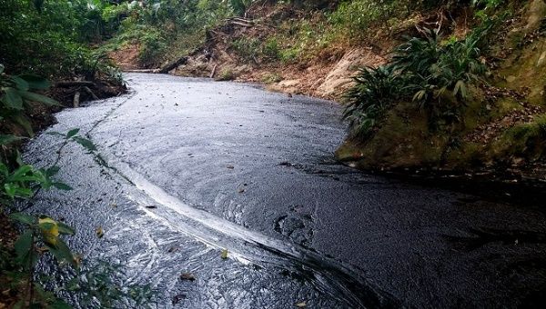 The crude spill along the Lizama River on March 20, 2018 in Barrancabermeja, Colombia. 
