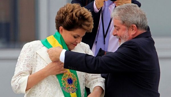 Brazil's President Dilma Rousseff receives the sash from outgoing President Luiz Inacio Lula da Silva outside Planalto Palace in Brasilia Jan. 1, 2011.