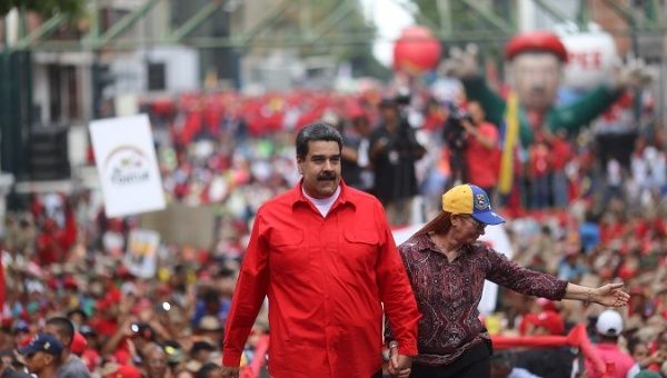 Venezuela's President Nicolas Maduro and his wife Cilia Flores attend a rally with supporters in Caracas.