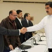 President Nicolas Maduro (R) shakes hands with Jesus Torrealba (L), former secretary of Venezuela's coalition of opposition parties in Caracas in 2016.