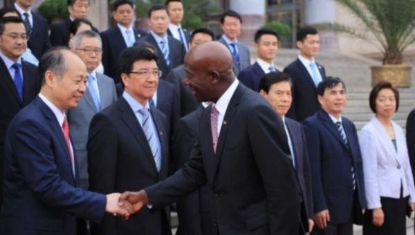 Chinese officials in Beijing welcome Trinidad and Tobago's Prime Minister Keith Rowley.