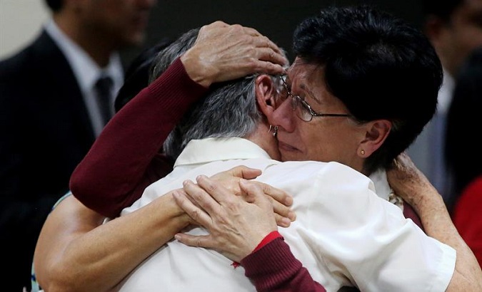 Mother and daughter hug each other after hearing the tribunal's sentence against four military officers for the disappearance of their son and brother Marco Antonio Molina Theissen. May 23, 2018.