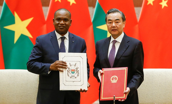 China's Foreign Minister Wang Yi and Burkina Faso Foreign Minister Alpha Barry establish diplomatic relations in Beijing.