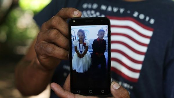 A Salvadoran immigrant, Arnovis Portillo shows a picture of his daughter Maybelline Guido, 6, who he lost contact with after being deported from the U.S..