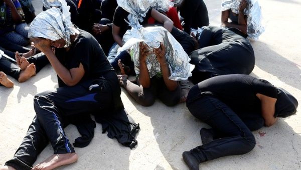 Migrants at a naval base after being rescued by Libyan coast guards in Tripoli, Libya, June 18, 2018. 