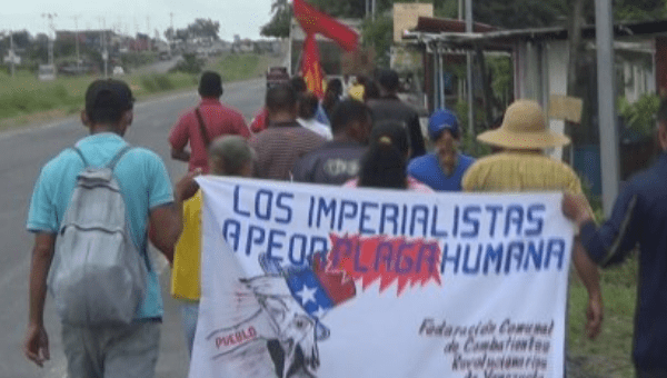 The Admirable Peasants March on its way to Caracas for almost two weeks, holding a sign against imperialism in Venezuela