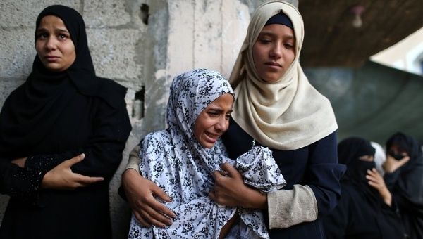 Relatives of Palestinian Sadi Muamar, who was killed by Israeli troops during a protest at the Israel-Gaza border, mourn during his funeral in the southern Gaza Strip.