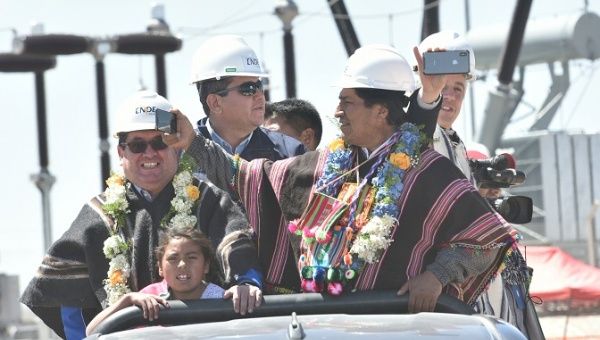 Bolivia's President Evo Morales takes pictures of a solar photo-voltaic plant during its inauguration in Uyuni, Bolivia, September 8, 2018.
