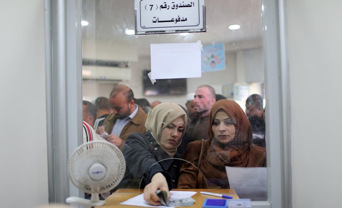 Palestine civil servants collect salaries from Quatari cash infusion to help aid Gaza.