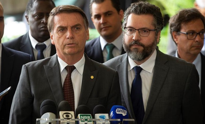 Ernesto Araujo (r), Brazil's new foreign minister does not believe in climate change.