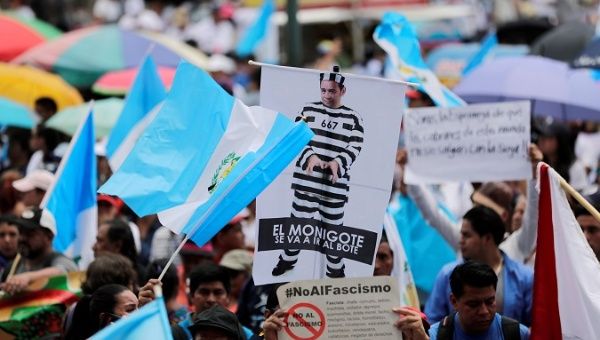 Guatemalans participate in a march against president Morales on Sept. 20.