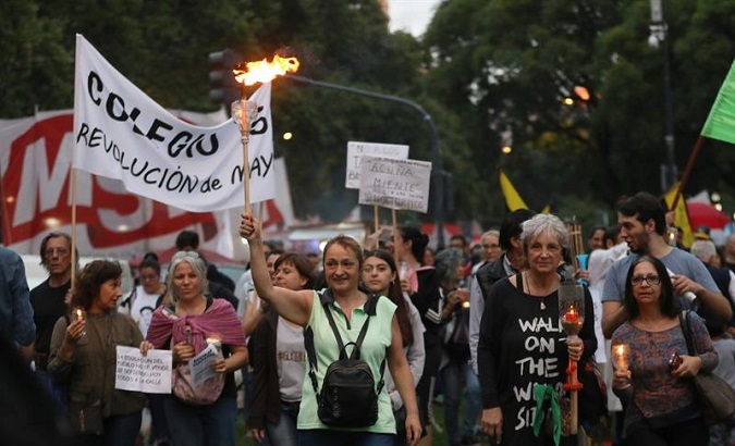 Argentine women participate in a demonstration in Buenos Aires against Macri's economic policies.