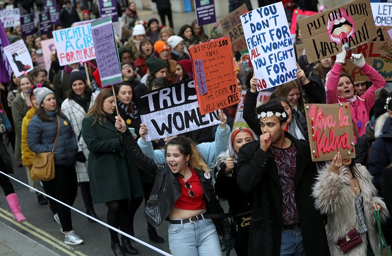 Protesters take part in the Women's March calling for equality, justice and an end to austerity in London, Britain.