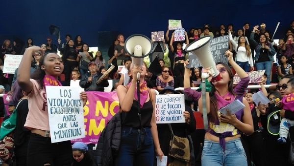Activists in Ecuador protesting against rape, femicide, and xenophobia.