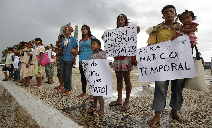 Guarani and Terena peoples demand land demarcation in Brasilia, Brazil, Mar. 21, 2018.