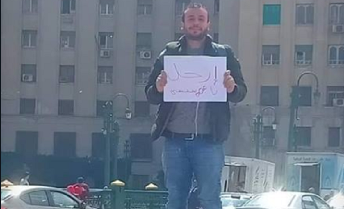 Ahmed Mohy was arrested by Egyptian police after holding a placard at the country's iconic Tahrir Square that says 