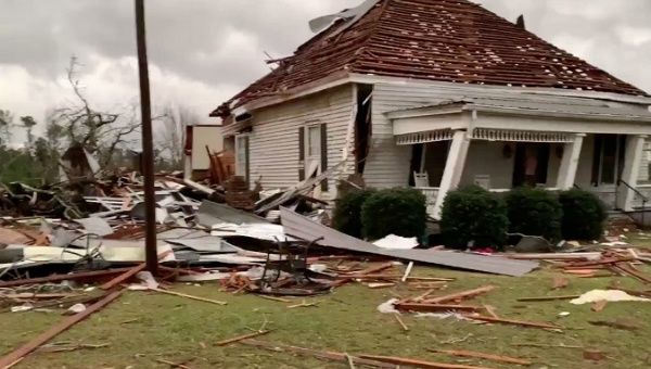 Debris and a damaged house seen following a tornado in Beauregard, Alabama, U.S. in this March 3, 2019 still image obtained from social media video. 