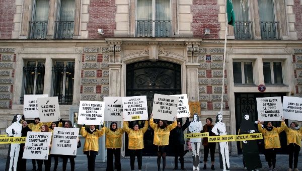 Demonstrators from Amnesty International hold placards outside the Saudi Arabian Embassy on International Women's day in Paris, France, March 8, 2019