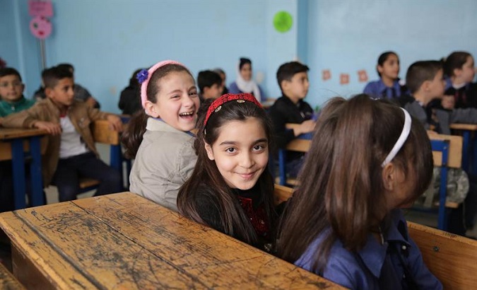 School children at a United Nations Relief and Works Agency for Palestine Refugees-run school at Al-Baqa'a in Palestine.