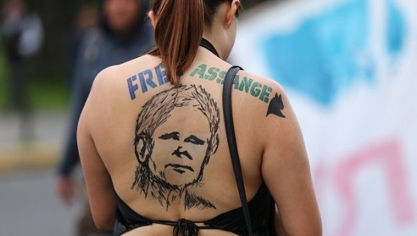 A woman participates in a protest in support of Julian Assange and against the government of Lenin Moreno in Quito, Ecuador on Tuesday.