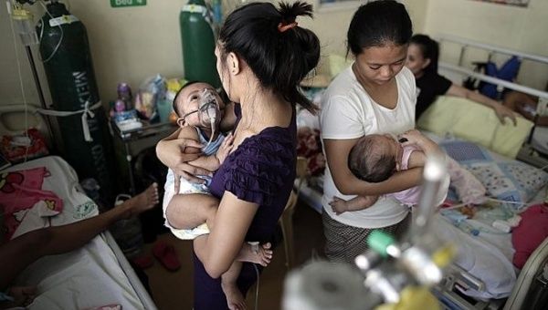 Children with measles in an overcrowded room at a government hospital in the Philippine capital Manila