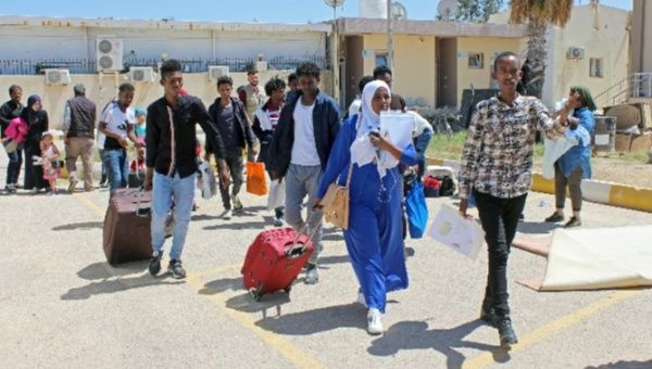 Migrants carry their luggage at Misrata airport, before their deportation and resettlement in Italy, in Misrata, Libya April 29, 2019.