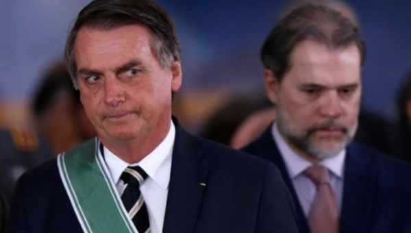 FILE PHOTO: Brazil's President Jair Bolsonaro and President of the Supreme Federal Court Dias Toffoli attend a swearing-in ceremony for the country's new army commander in Brasilia, Brazil January 11, 2019.