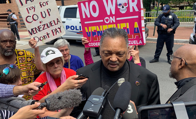 Rev. Jesse Jackson talks to reporters outside the Venezuelan embassy in Washingon, D.C. after he delivered food to the Protecotors Collective inside the building.