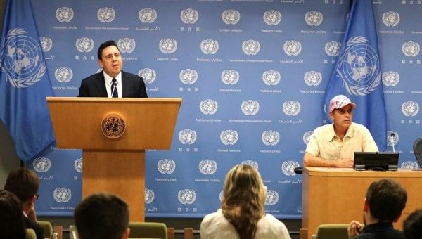 Venezuela's Ambassador to the U.N., Samuel Moncada (left), and Tigh Barry (right) from Code Pink held a press conference regarding the embassy situation in Washington DC.
