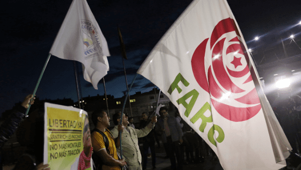 Revolutionary Alternative Force of the Common (FARC) Political party flags are seen during a protest in support of the release of former FARC leader Jesus Santrich, in Bogota, Colombia May 15, 2019
