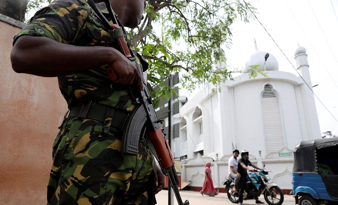 A soldier stands guard outside the Grand Mosque in Negombo.