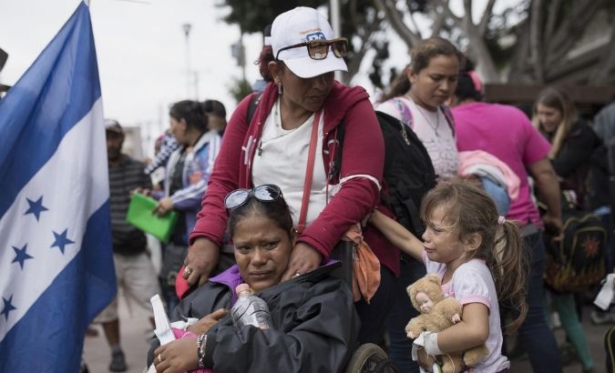 Members of a Central American family traveling with a caravan of migrants prepare to cross the border and apply for asylum in the United States, in Tijuana, Mexico, Sunday, April 29, 2018.