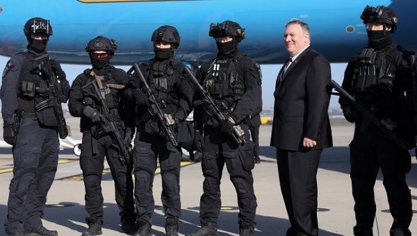 U.S. Secretary of State Mike Pompeo poses for a photo with local police who were part of his security detail, before he boards his plane to depart Sydney International AIrport in Sydney, Australia August 5, 2019.