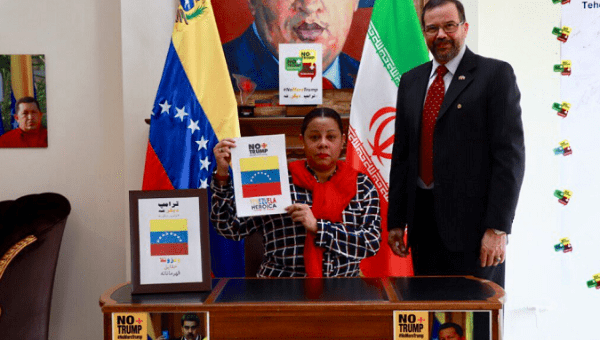 Venezuelan and Iranian authorities sign the 'No More Trump' petition in Tehran
