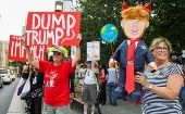 Citizens protest prior to President Donald Trump