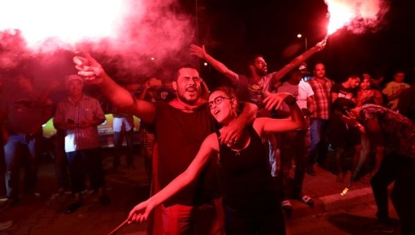 Supporters of detained presidential candidate and Tunisian media mogul Nabil Karoui react after unofficial results of the Tunisian presidential election in Tunis, Tunisia, September 15, 2019.