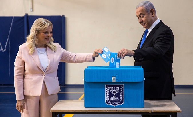 Israeli Prime Minister Benjamin Netanyahu and his wife Sara cast their vote during Israel's parliamentary election at a polling station in Jerusalem September 17, 2019.