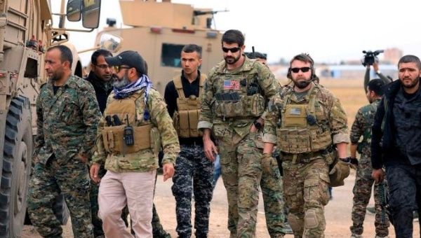 Syrian Democratic Forces and U.S. troops are seen during a patrol near Turkish border in Hasakah, Syria November 4, 2018. 