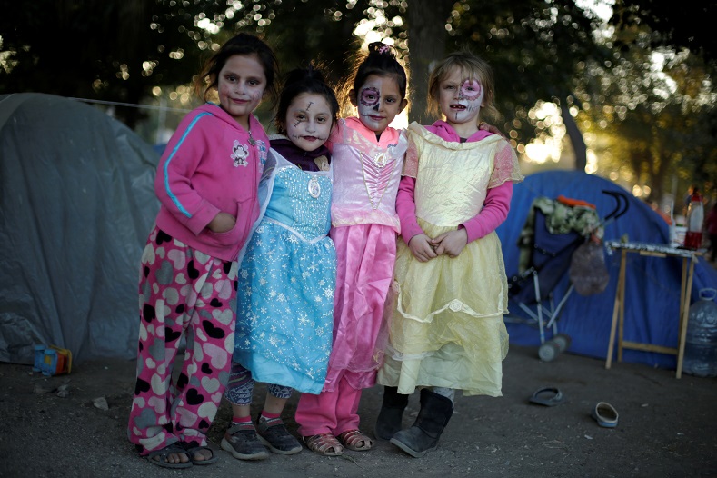 Migrant children, who are camping and waiting to apply for asylum to the U.S., painted their faces as 'Catrinas' in Ciudad Juarez, Mexico, Oct. 31, 2019.