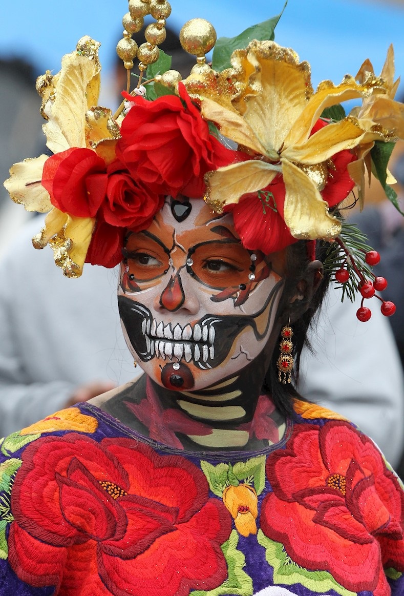 Woman during the inauguration of the gigantic offering to the dead placed in the Zocalo, Mexico City, Mexico, Nov. 1, 2019.
